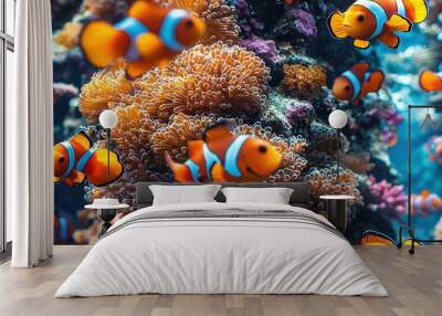   A school of clownfish swim alongside a cluster of sea anemones in a vibrant coral reef Wall mural