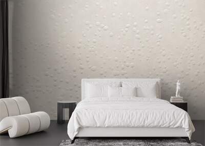  a white wall with lots of water drops all over the wall and a black object in the middle of the picture on the right side of the wall.  generative ai Wall mural