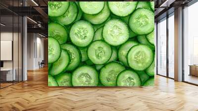   A wooden table holds several piles of cut and sliced cucumbers Wall mural