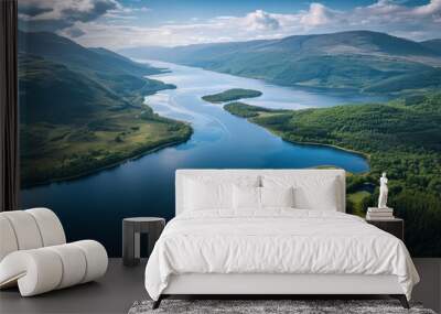  an aerial view of a body of water surrounded by lush green hills and a blue sky with puffy white clouds in the middle of the middle of the picture. Wall mural