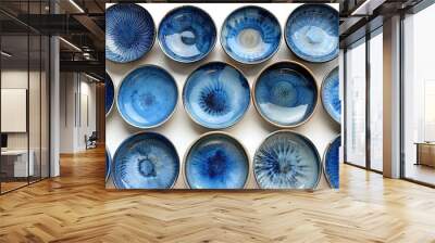   Blue bowls cluster on white counter, swirling with various sized blue shapes Wall mural