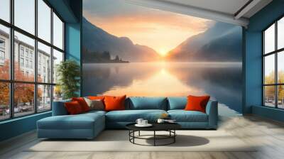   Mountains surrounding water, sun sinking into it, and foggy atmosphere Wall mural