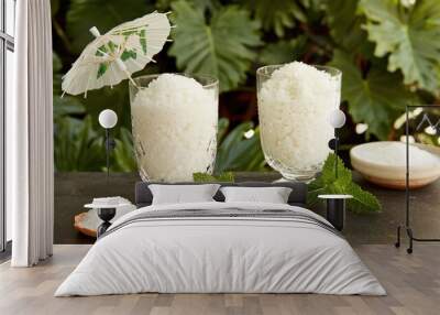  Rice and sugar in bowls; green plant beside glasses Wall mural