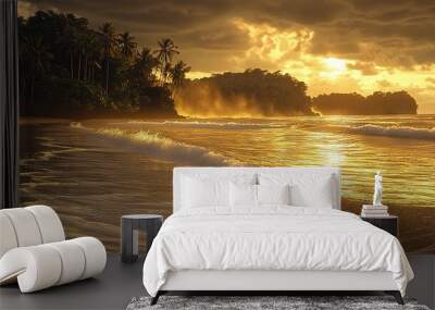   Sun setting on a tropical beach with waves crashing in front of shore and palm trees in background Wall mural