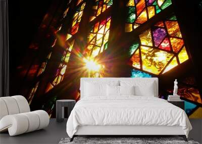   The sun illuminates the colored glass panes in the church's holiest sanctuary, casting a radiant glow on the intricate designs Wall mural