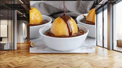  Two bowls of ice cream topped with nuts rest on a white table covered in a gray napkin Wall mural