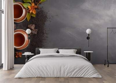  two cups of tea sitting on top of a table next to a pile of dirt and a leafy plant. Wall mural