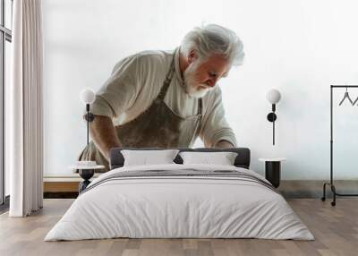 A man in a white shirt and apron is working on a wooden table Wall mural