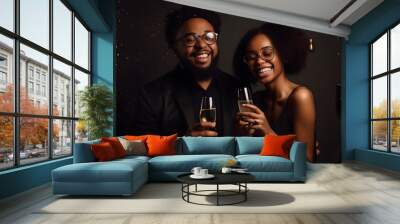 African American girl and guy drinking champagne, on a black background. Holiday concept. Wall mural