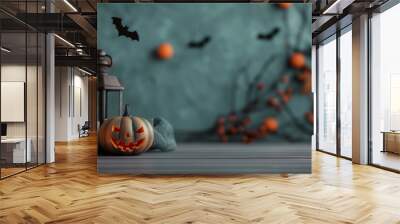 Autumn halloween composition with copy space. Creepy smiling jack pumpkin, candles, paper bats and nature fall decor. Seasonal Halloween layout for sale announcement or promo banner. Wall mural