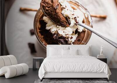 chocolate cake with coffee chocolate mousse cream in a glass cup on a white background with whipped  Wall mural