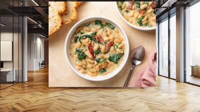 Bowls with Tuscan butter beans stew with spinach and sun-dried tomato, vegan cream. Vegetarian homemade meal. Wall mural