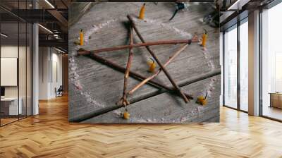 Branch Pentagram - witchcraft tools of natural wood. Esoteric still life with elements of pagan magic. occultism and mysticism. Wall mural