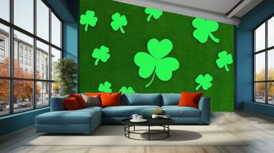 Clover leaves on a green background. The traditional Irish holiday is St Patrick's day. Wall mural