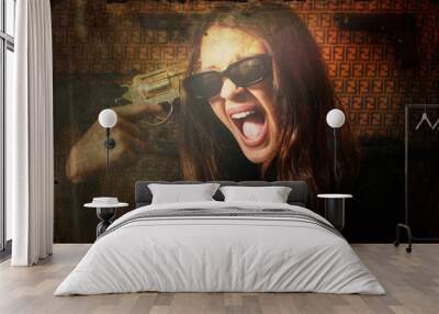 Dangerous and beautiful woman with a gun Wall mural