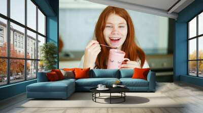 face of a teenage girl with pimples, acne on the skin, portrait of a cool happy teen girl drink a tea Wall mural