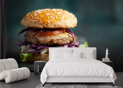 Burger with purple cabbage over black textured board  Wall mural