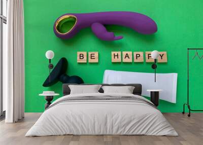 Sex toys and lubricant. Vibrator, butt plug and tube on green background. Letter BE HAPPY. Useful for sex shop Wall mural