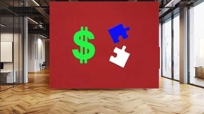 Green dollar sign, two blue and white puzzles on a red background. Business, financial cash, planning. Wall mural