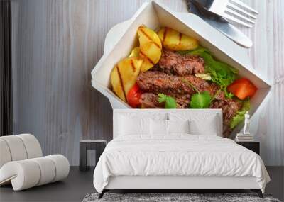 grilled steak and vegetables in a shipping container Wall mural