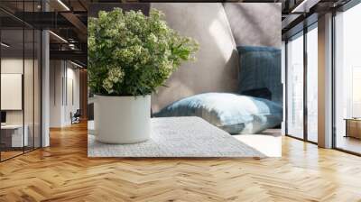 Interior. Room. Bouquet of white, field flowers in iron, rough. a white mug on a table covered with a lace tablecloth. Sofa, pillows from old jeans. Summer. Cosiness. Rustic. Country house. Wall mural