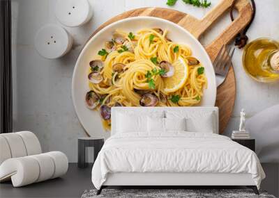 Italian pasta spaghetti with clams and lemon or Spaghetti alle vongole verace, cooked with oil, white wine, garlic, parsley. Top view. Wall mural