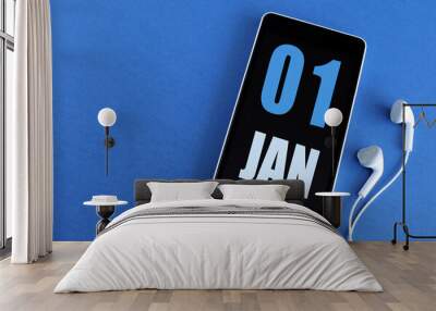 January 1. 1 st day of the month, calendar date. Smartphone and white headphones on a blue background. Place for your text. Winter month, day of the year concept. Wall mural