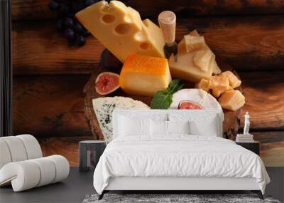 assortment of cheese, camembert and parmesan on wooden background Wall mural