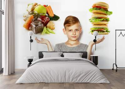 blond boy chooses between healthy food and fast food Wall mural