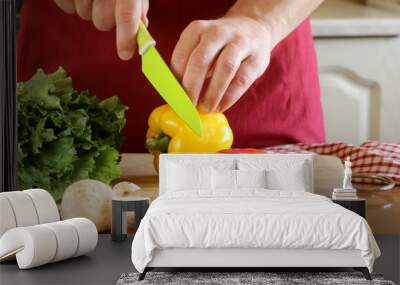 hand man chef cooking vegetable salad on wooden table Wall mural