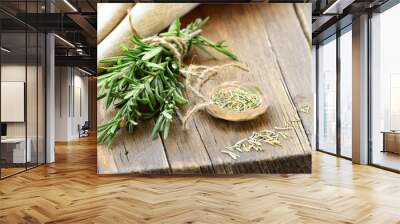 organic bunch of rosemary on wooden board Wall mural