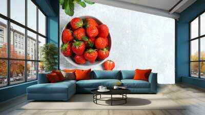 organic strawberries in a bowl on a gray background Wall mural