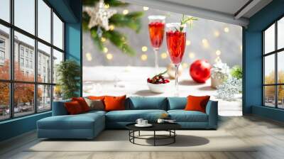 Mimosa festive drink for Christmas - champagne red cocktail Mimosa with cranberry for Christmas party, copy space Wall mural