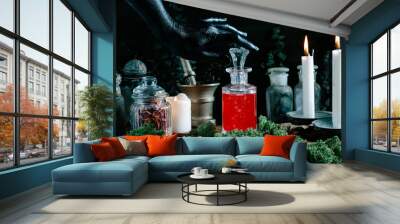 black witch hand opening magic potion, herbs ingredients candles and magical equipment Wall mural