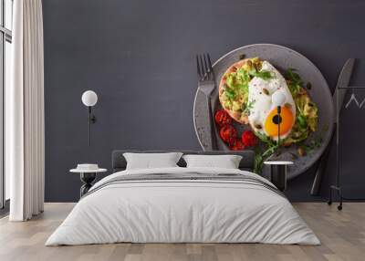 breakfast avocado sandwich with fried egg and tomato Wall mural