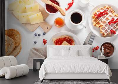 breakfast with waffle, toast, berry, jam, chocolate spread and coffee. Top view Wall mural