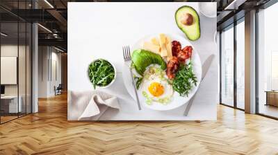 healthy keto breakfast: egg, avocado, cheese, bacon Wall mural