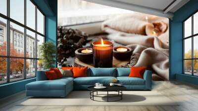 warm cozy window arrangement, winter or autumn concept, candles throw lights Wall mural