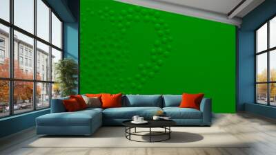 Abstract background in green colors with many convex and concave small circles, arranged in a heart shape Wall mural