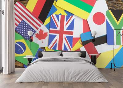 paper cards with state flags of different countries on the table close up Wall mural