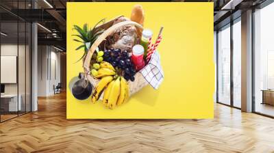 Basket filled food fruits drinks picnic summer rest Wall mural