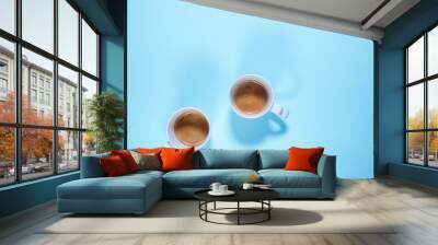 Fresh cups cappuccino coffee milk on pastel blue Wall mural