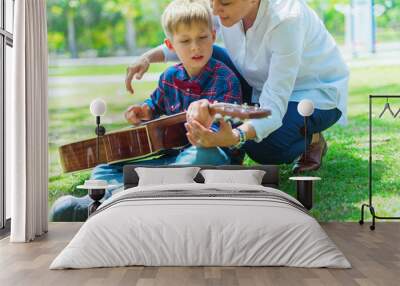 Happy boy in checkered shirt playing and learning Wall mural