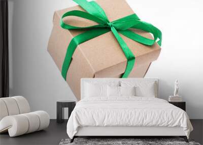 Object elegant beige gift box with green ribbon bow falling, flying in air with shadow Isolated Wall mural