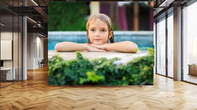 Portrait of charming little girl in the swimming pool. Cute face and wet blond hair. Summer concept. Vacation in Asia. Happy childhood. Wall mural