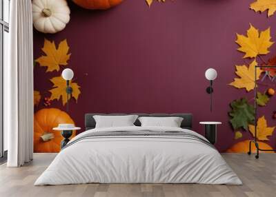 Pumpkin and autumn leaves still life square frame with copy space at the center. Top view festive fall flat lay at dark maroon background. Thanksgiving, harvest day or Halloween celebration concept.   Wall mural