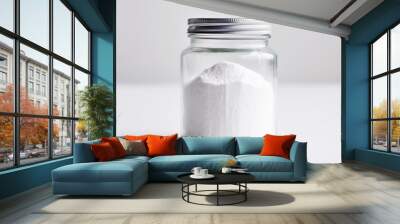 Jar with white powder on a white background. Wall mural