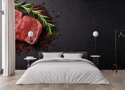 Raw rib eye steak of beef on a wooden Board with a meat cleaver and seasonings Wall mural