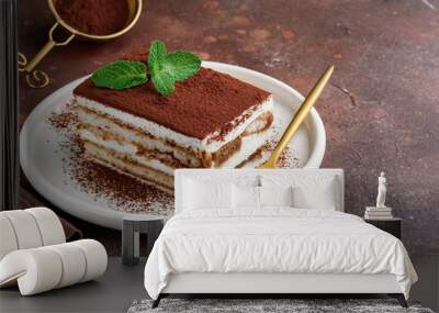 Traditional italian dessert tiramisu on a white plate. Copy space. Selective focus Wall mural