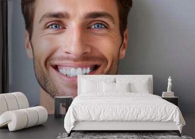 Smiling man on grey background, teeth whitening. Wall mural